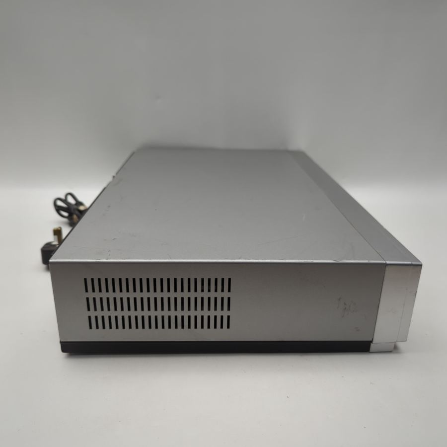 Representative photograph of the same model: Samsung DVD‑V6000 VHS / VCR/ DVD Dual Deck Player Recorder Premium Bundle – image 10